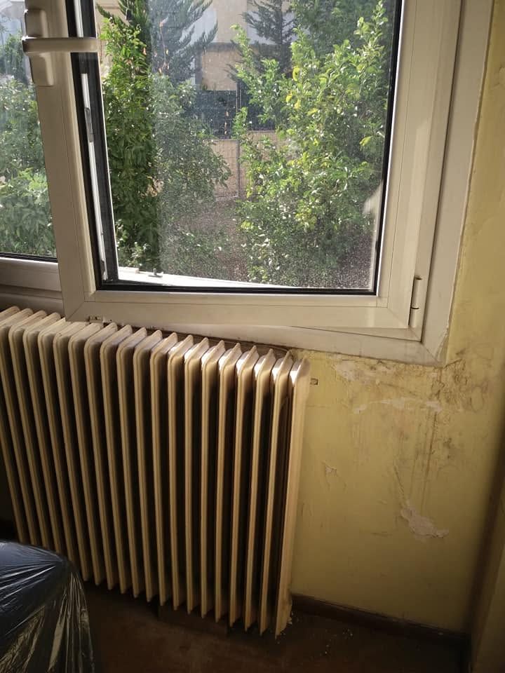 Stains on the wall next to the radiator