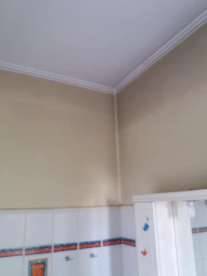 The walls above the tiles before painting