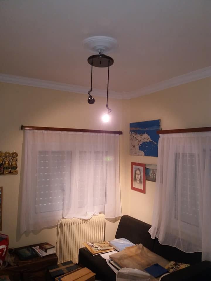 The room with curtains and pictures back in place