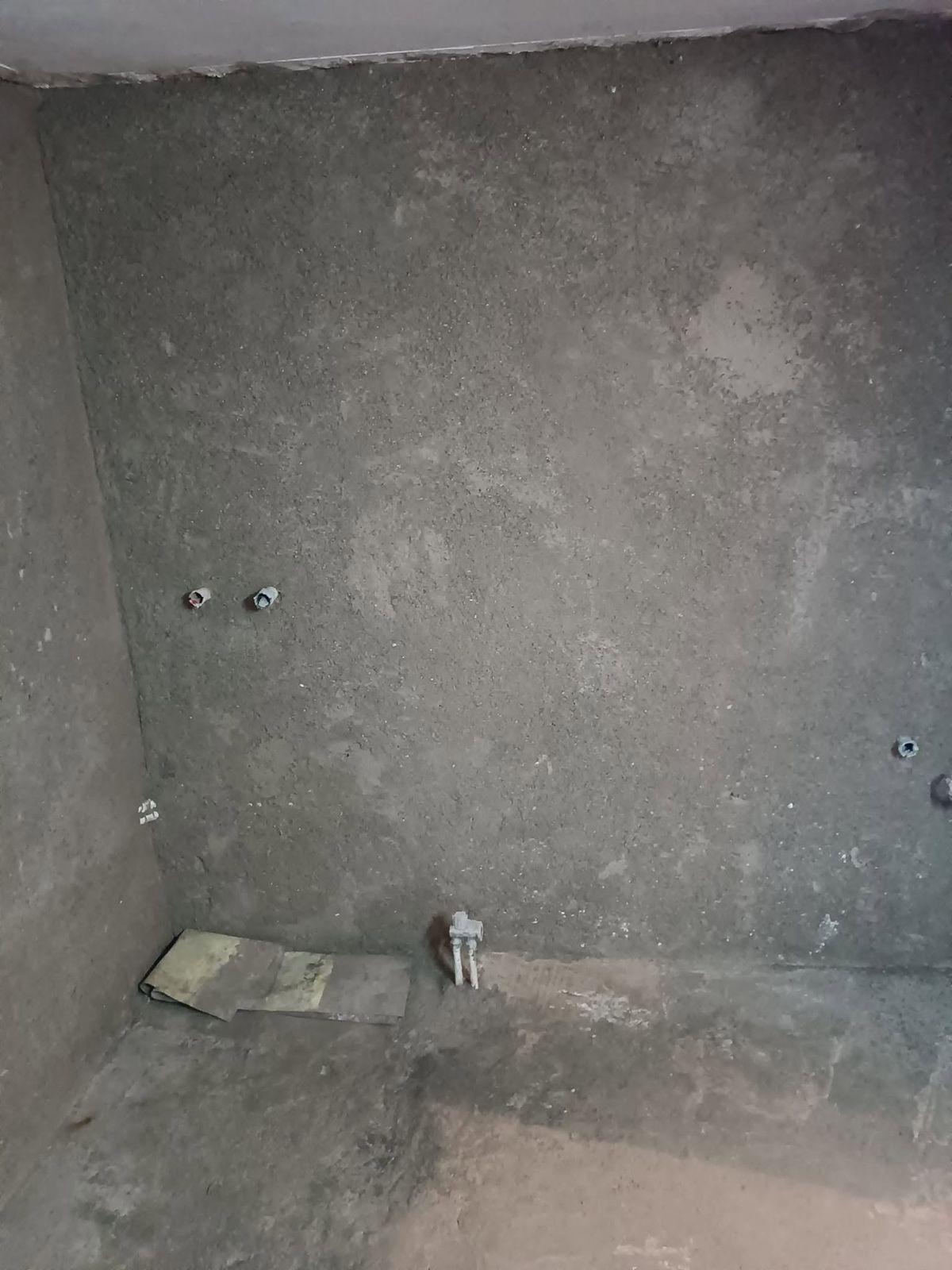 The walls with their final coat of render before tiling