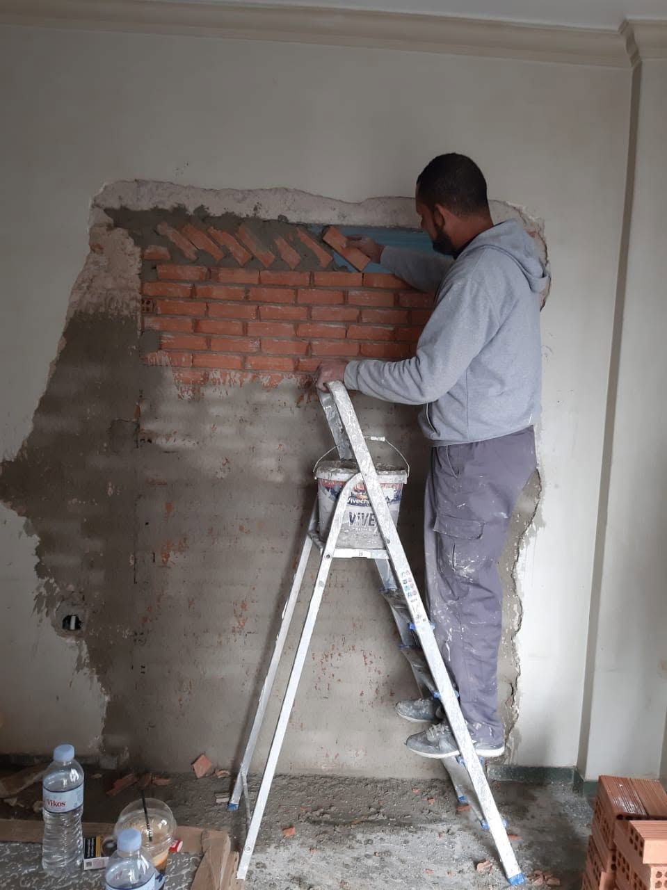 The brickwork reaching the ceiling