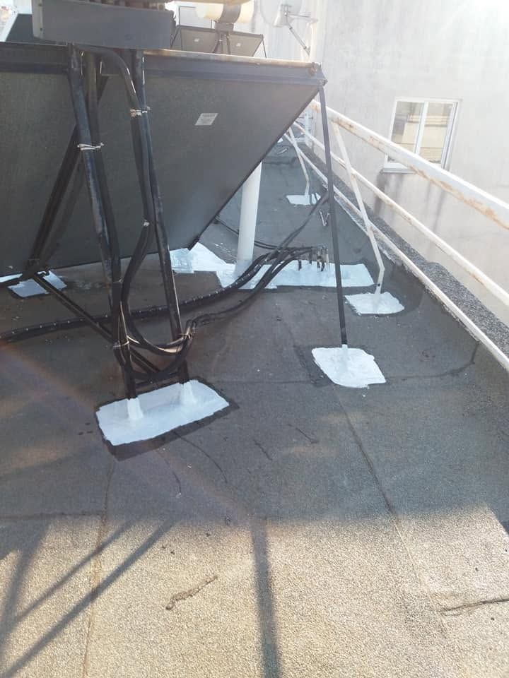 Solar water heater feet with white waterproofing